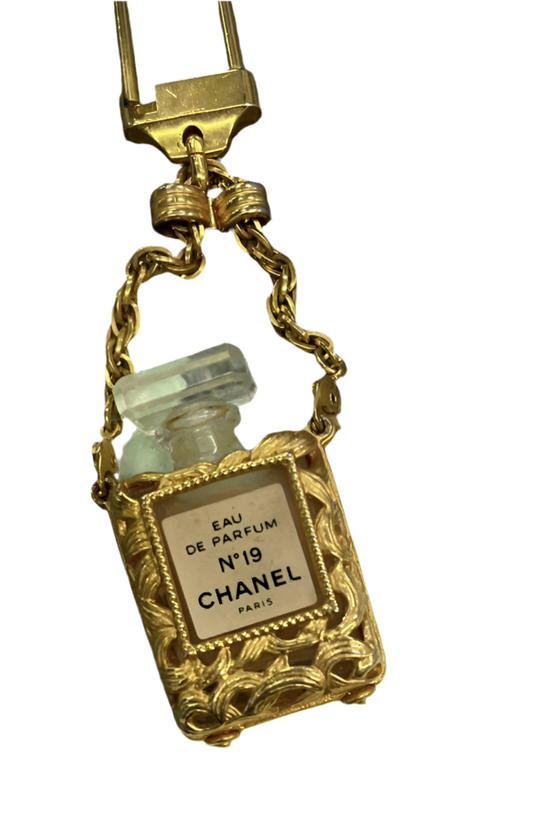 Chanel rare perfume charm and Chanel magnifying glass necklace